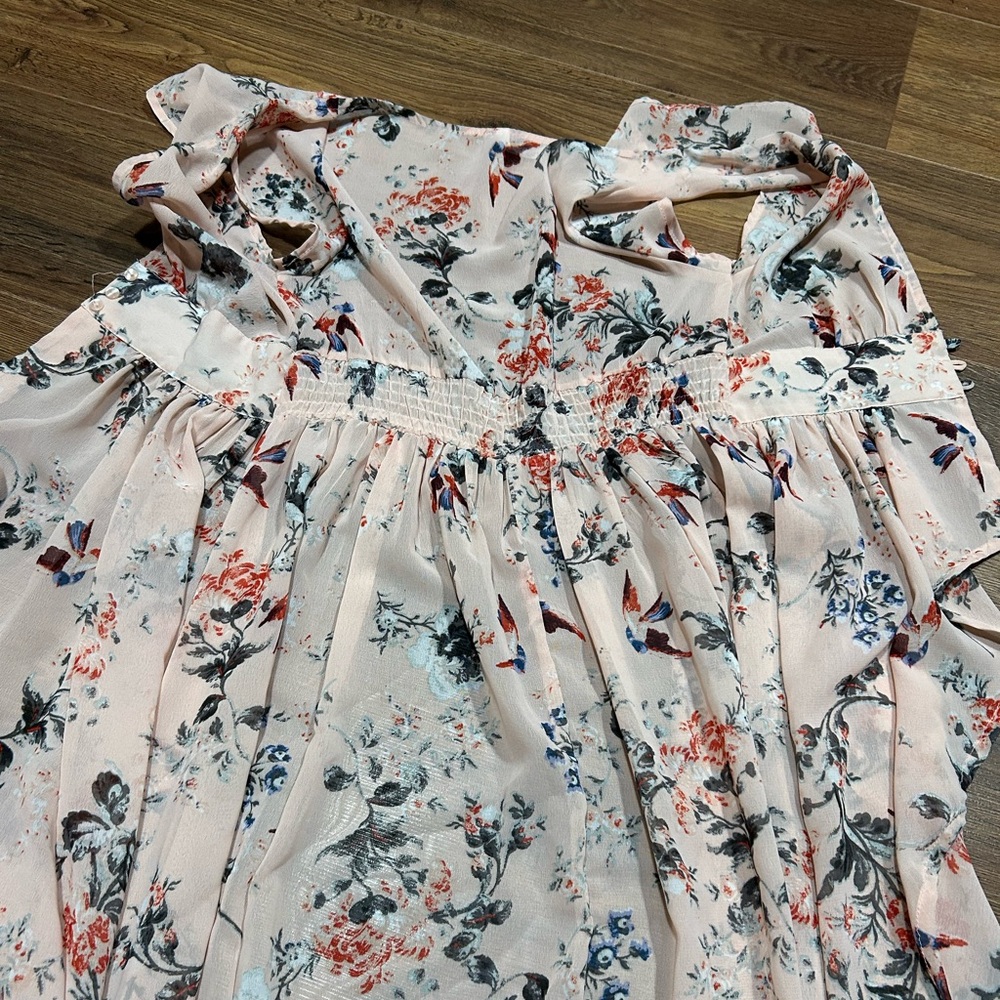 Two floral dresses one pink and one greenish blue